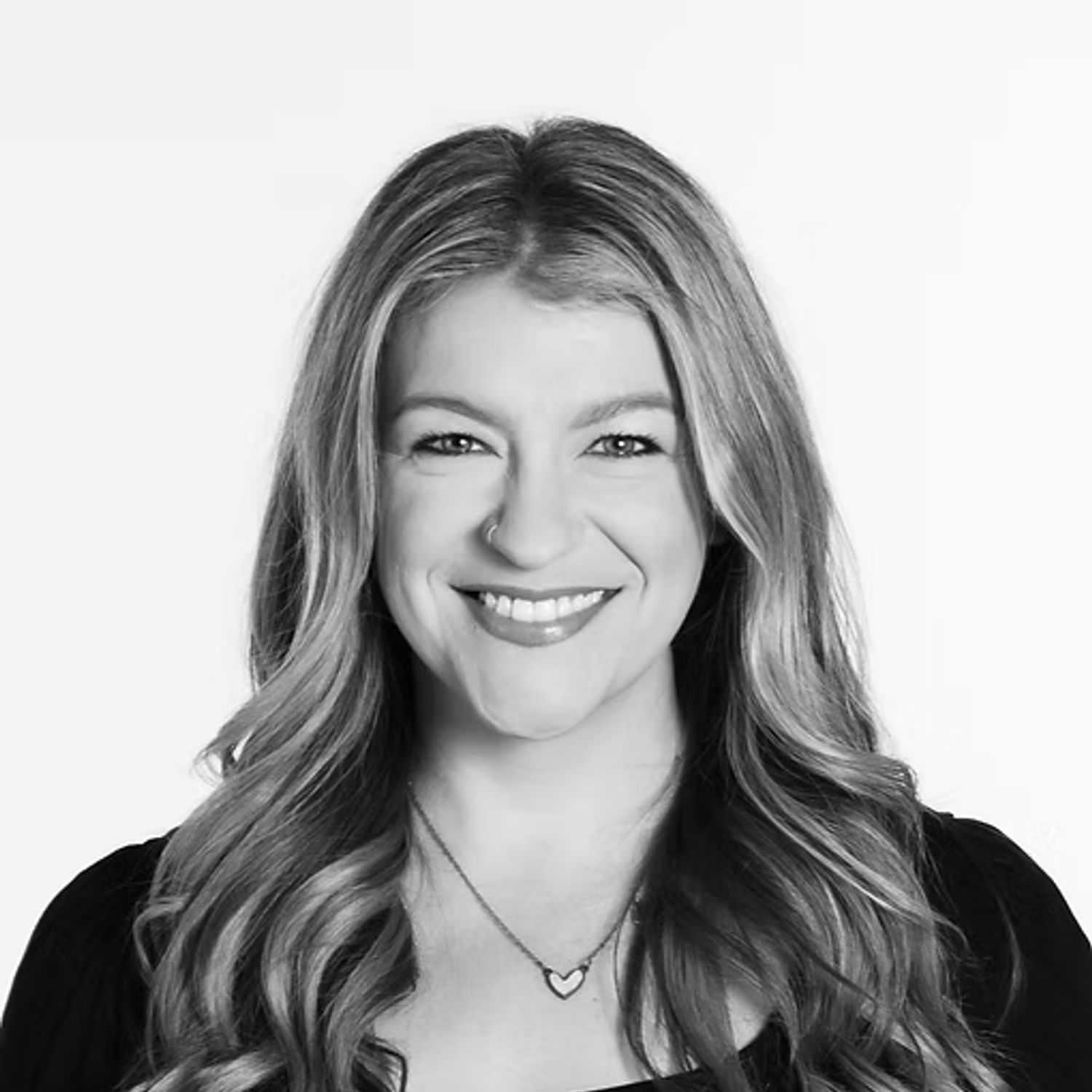 Portrait of Nicole Jeffrey, a professional stylist at Dominic Michael Salon, showcasing their expertise and style.