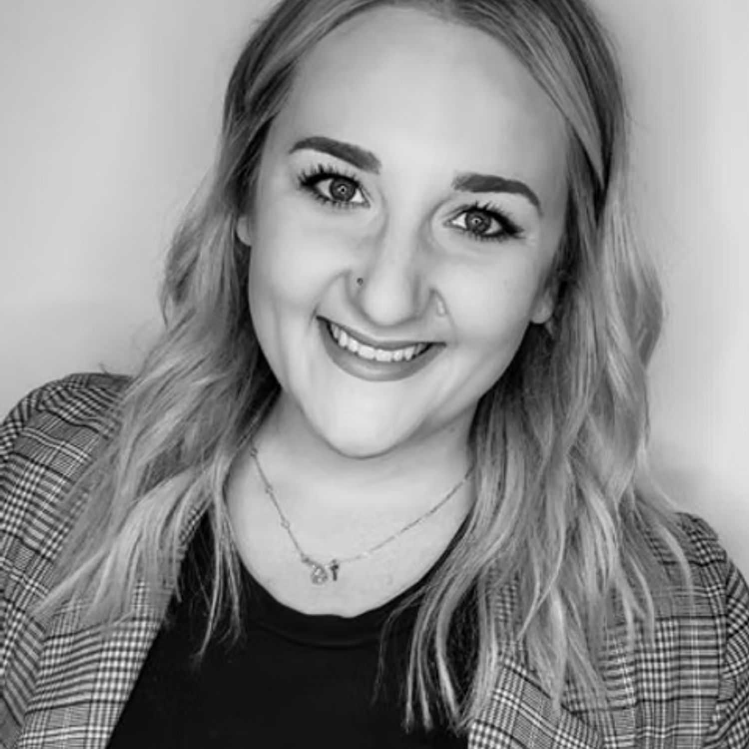 Portrait of Natalie Reinhold, a professional stylist at Dominic Michael Salon, showcasing their expertise and style.