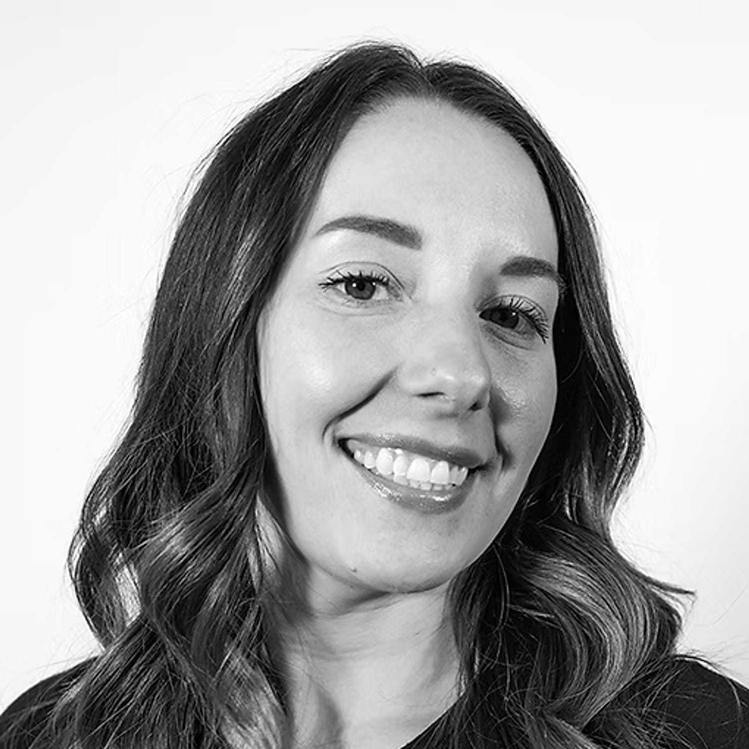 Portrait of Ashley Alvey, a professional stylist at Dominic Michael Salon, showcasing their expertise and style.