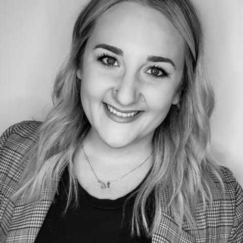 Portrait of Natalie Reinhold, a professional stylist at Dominic Michael Salon, showcasing their expertise and style.