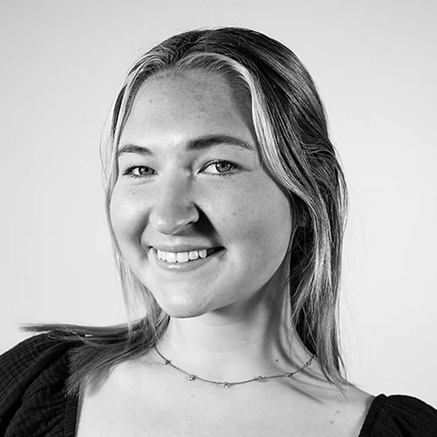 Portrait of Emily Thum, a professional stylist at Dominic Michael Salon, showcasing their expertise and style.