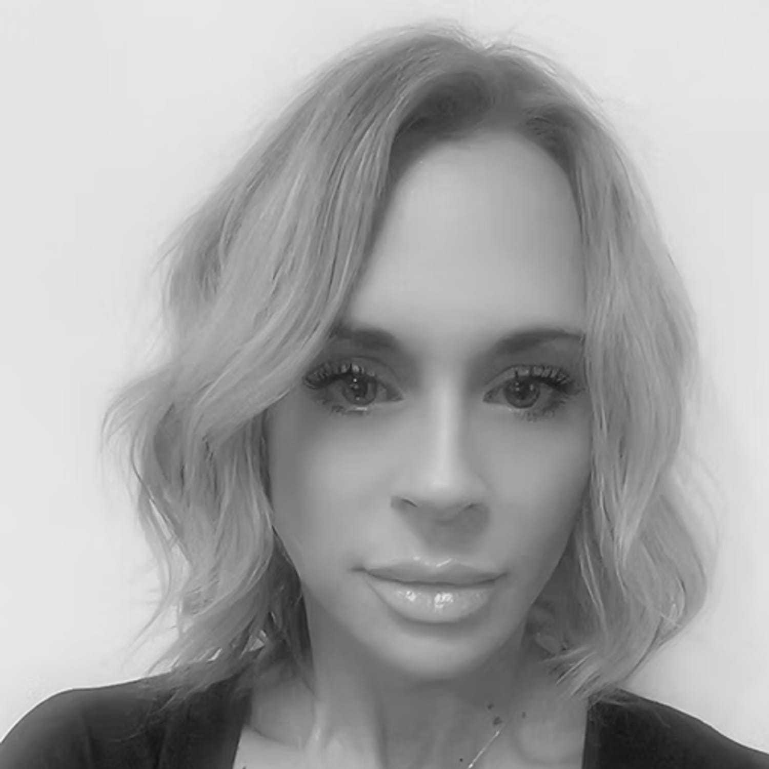 Portrait of Ashley Weymouth, a professional stylist at Dominic Michael Salon, showcasing their expertise and style.