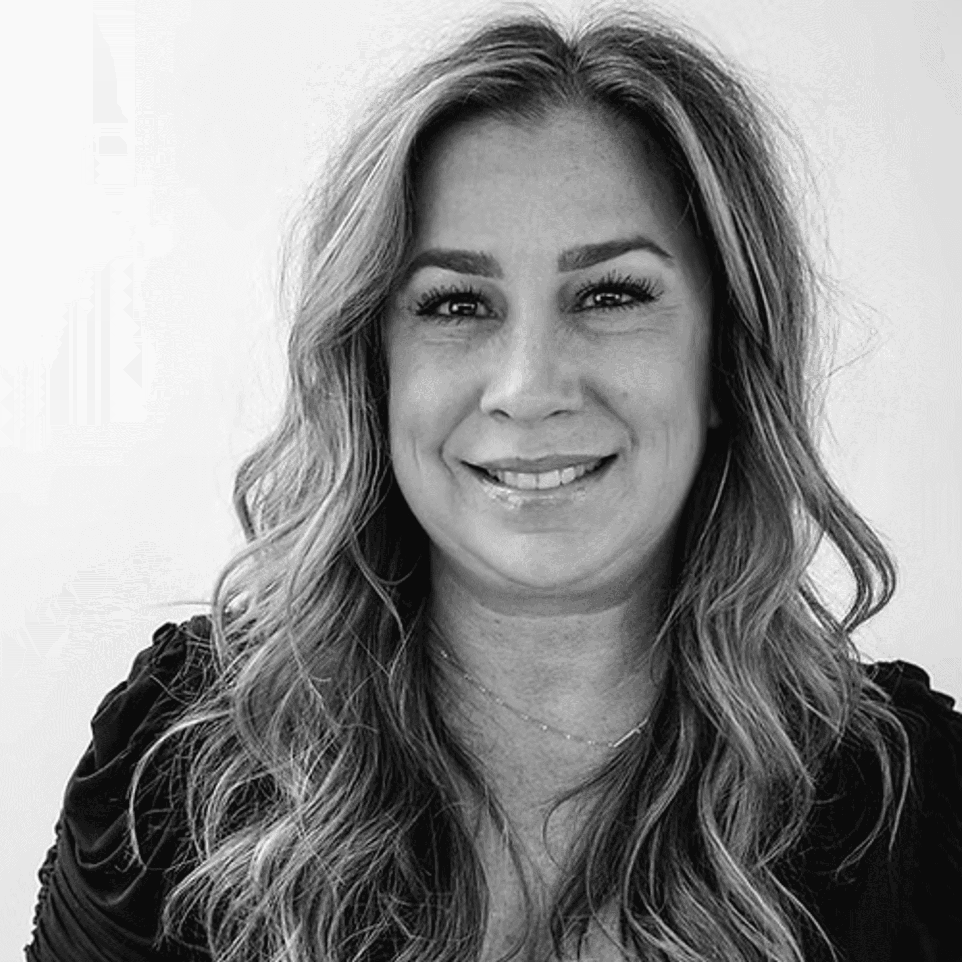 Portrait of Kelly Williams, a professional stylist at Dominic Michael Salon, showcasing their expertise and style.