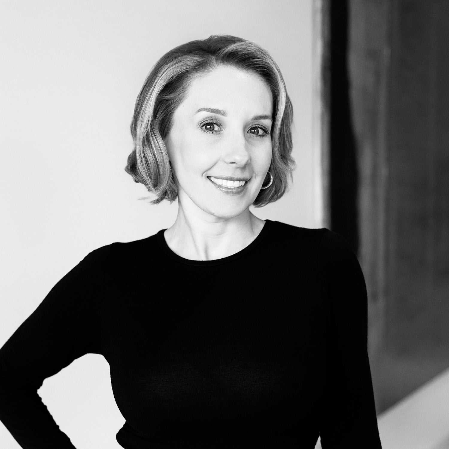 Portrait of Ashley Alvey, a professional stylist at Dominic Michael Salon, showcasing their expertise and style.