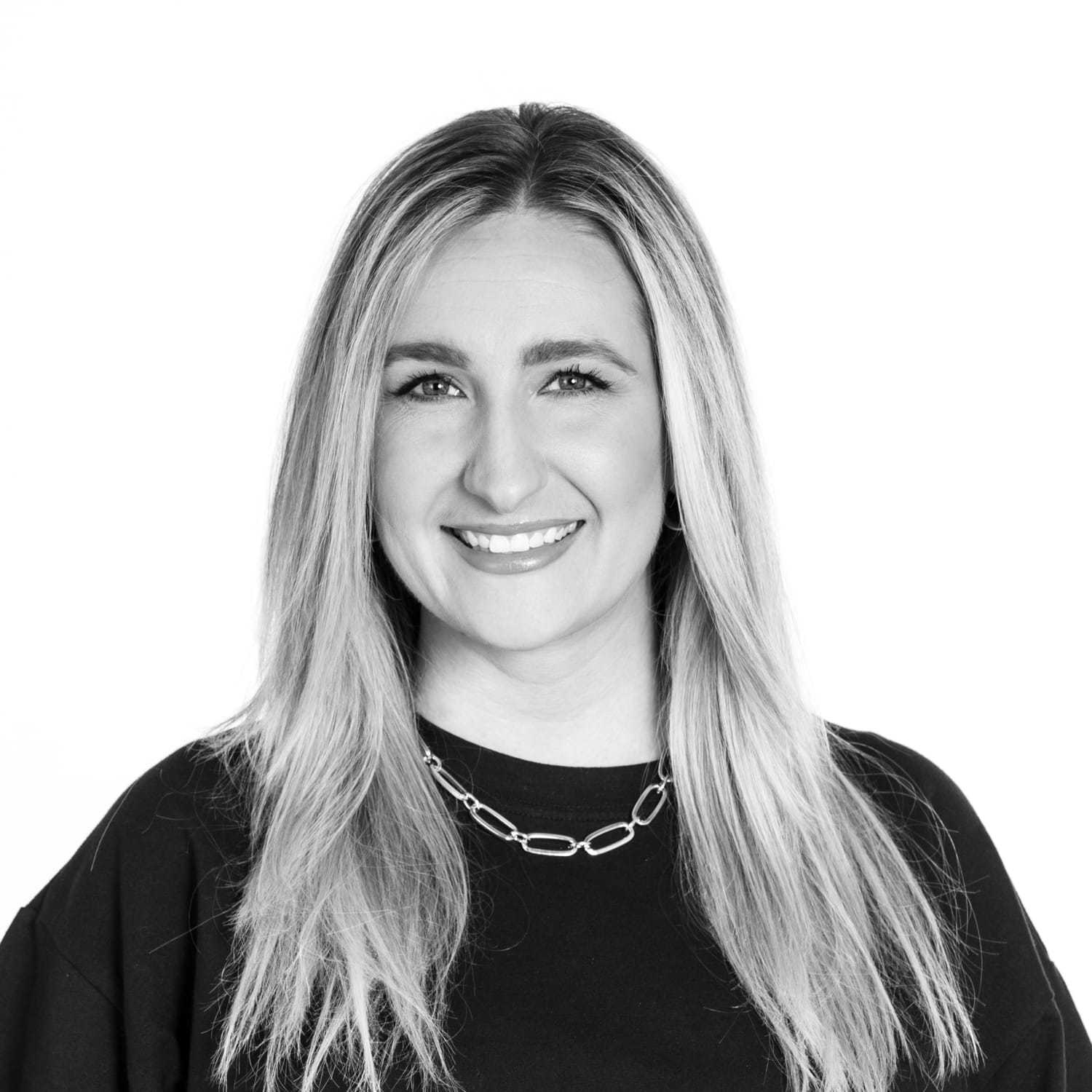 Portrait of Dani Stassi, a professional stylist at Dominic Michael Salon, showcasing their expertise and style.