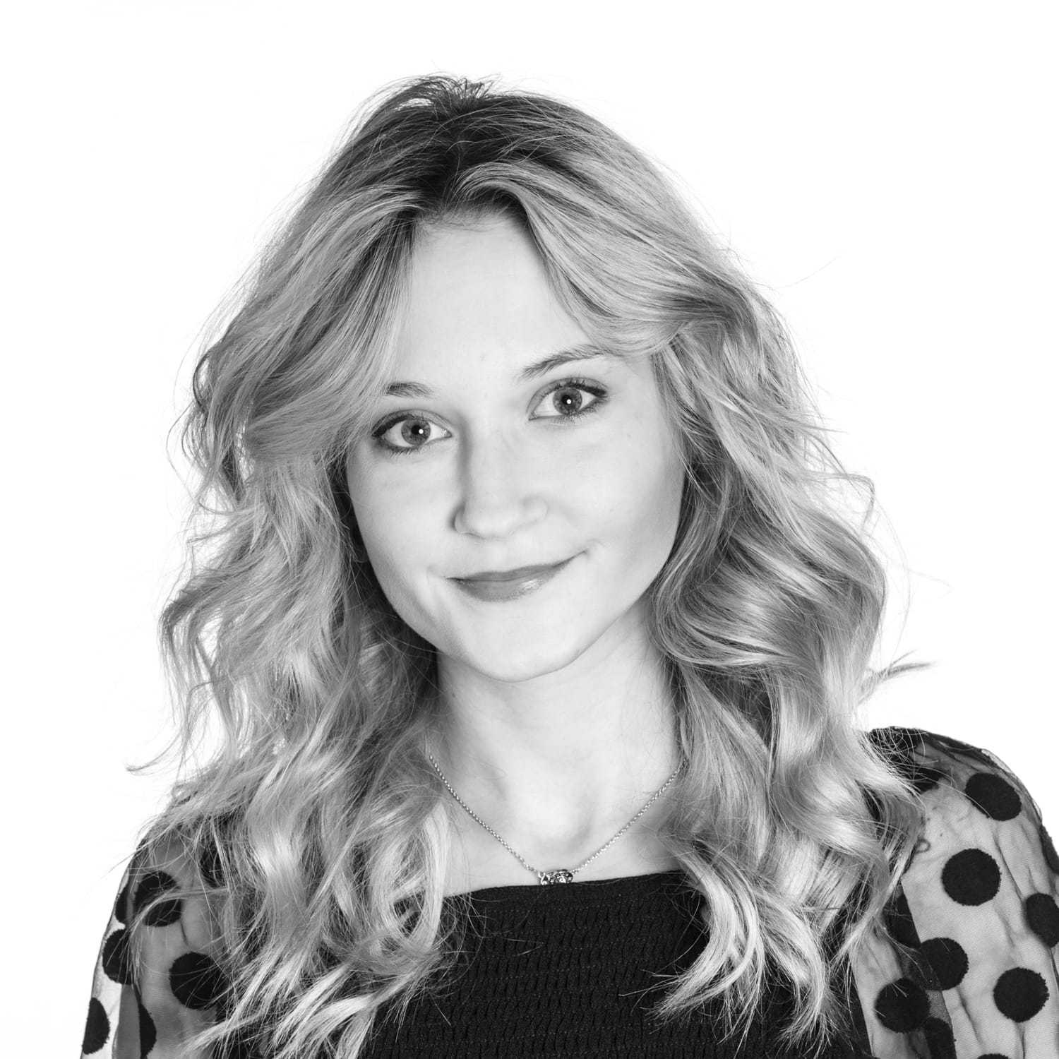 Portrait of Irina Grimm, a professional stylist at Dominic Michael Salon, showcasing their expertise and style.