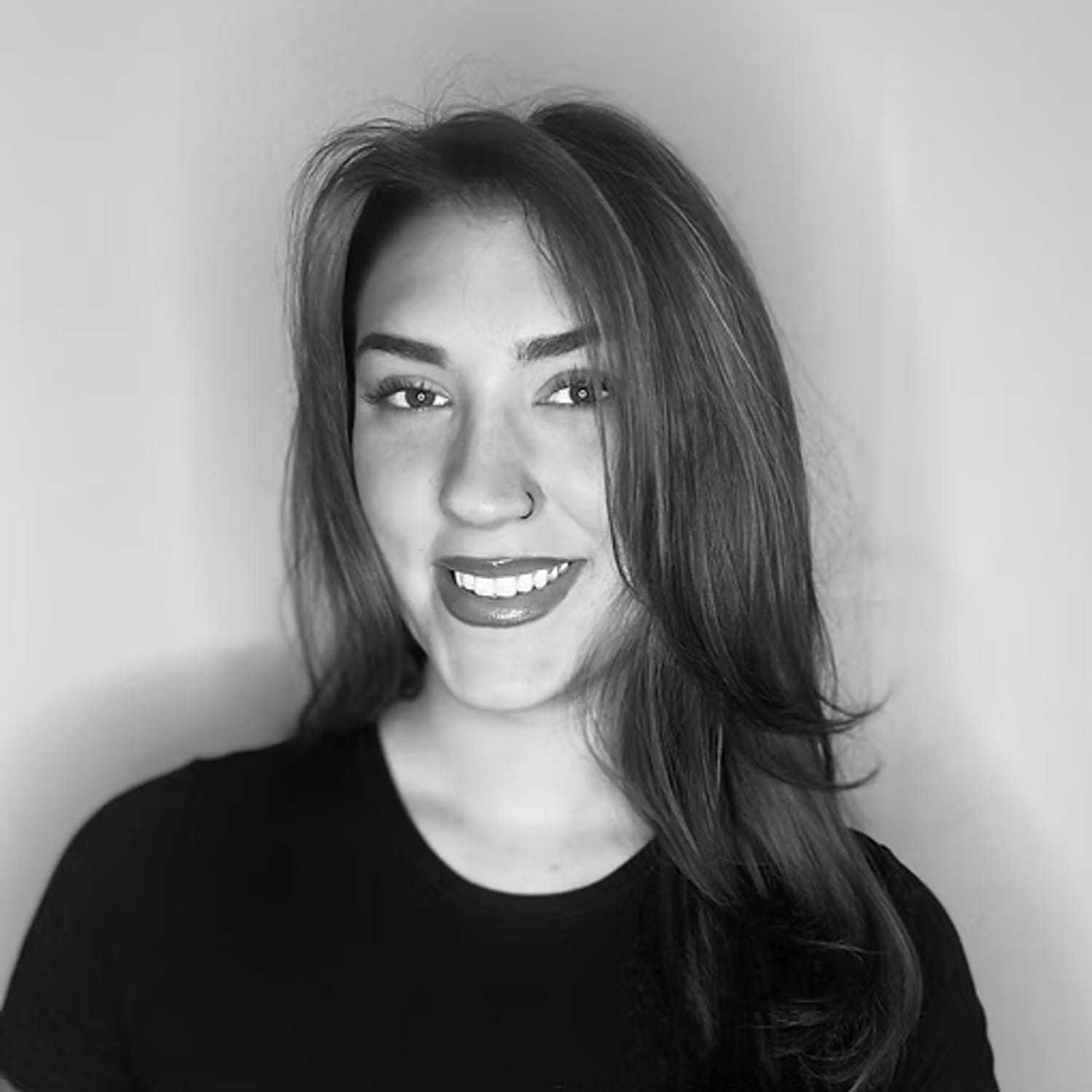 Portrait of Ava Spies, a professional stylist at Dominic Michael Salon, showcasing their expertise and style.